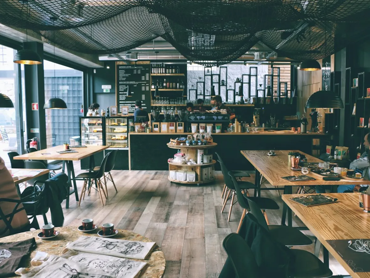 A bright cafe with wooden tables